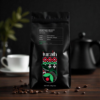 Black coffee bag with 'turath' branding on a wooden surface with coffee beans and a cup in the background.